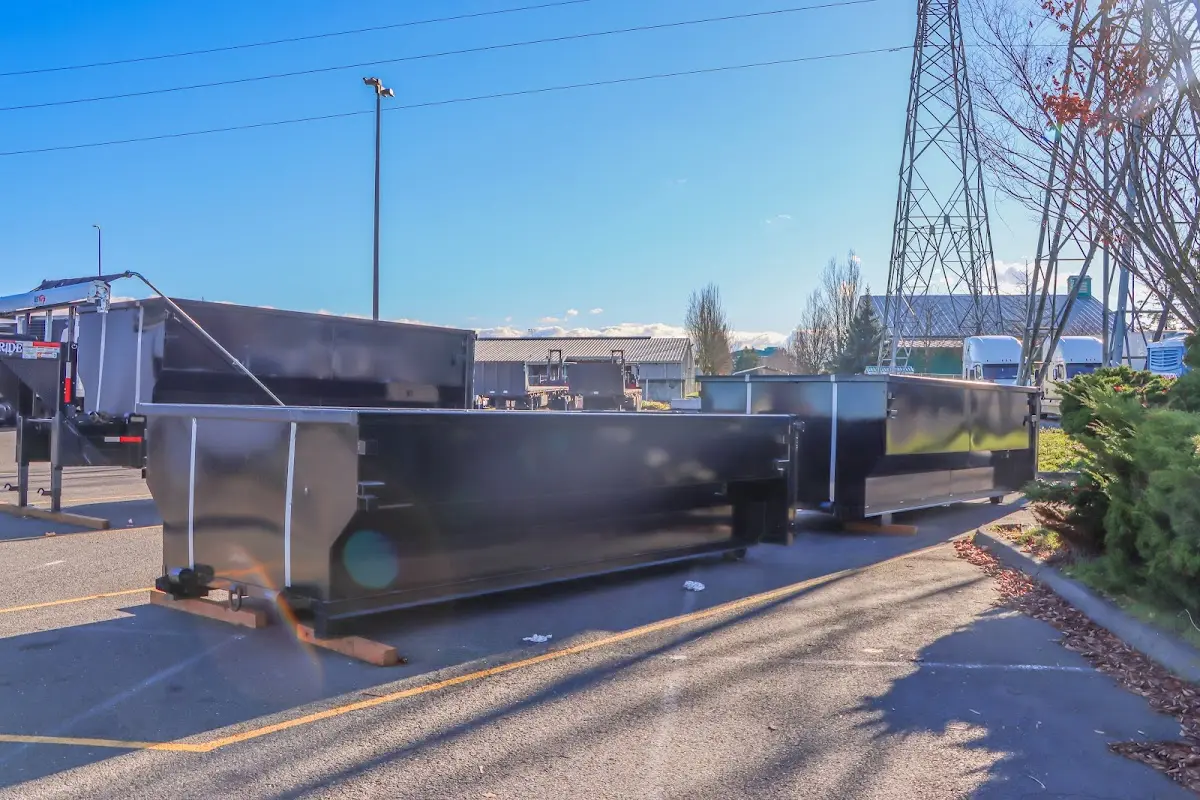 Roll-off dumpster ready for waste disposal at job site for 2 Yard Dumpster Rental in Wharton